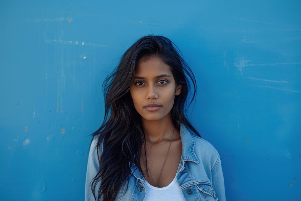 Indian american woman blue casual clothing contemplation.