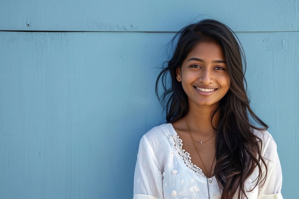 Indian american woman adult smile wall.