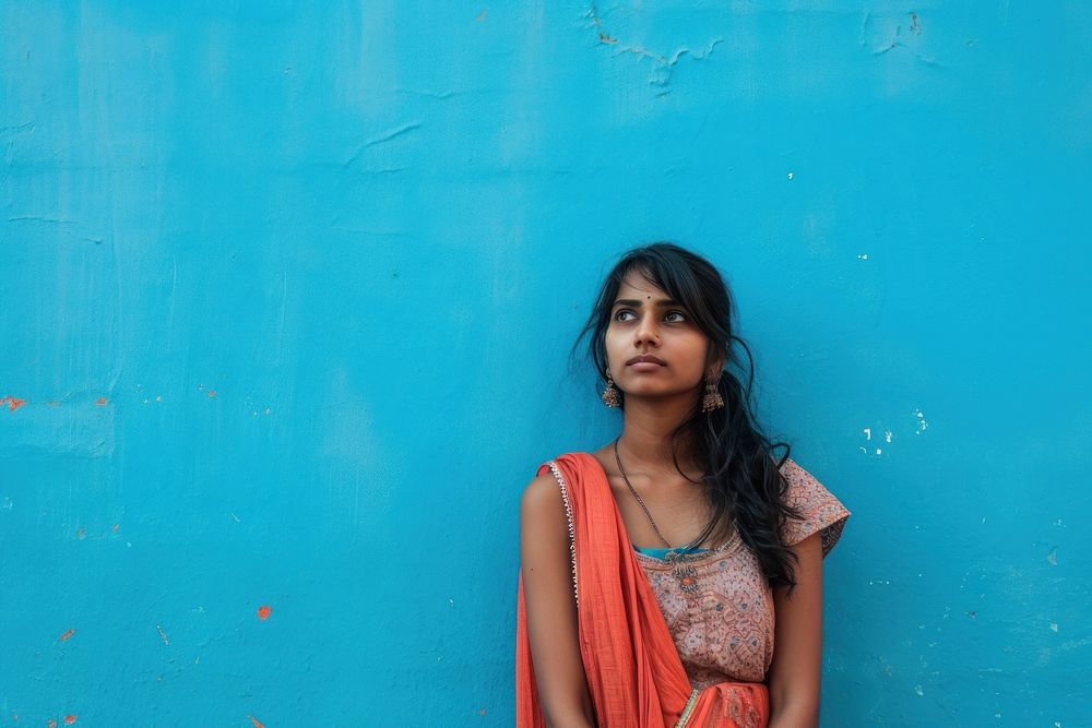Indian woman clothing blue wall.