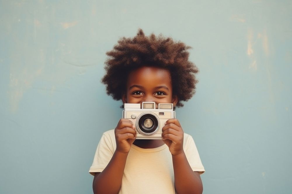 Smiling african kid photography portrait camera.