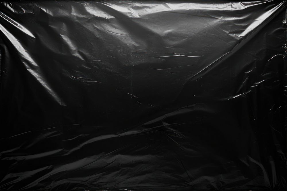 Transparent plastic wrap over black background backgrounds transportation monochrome.