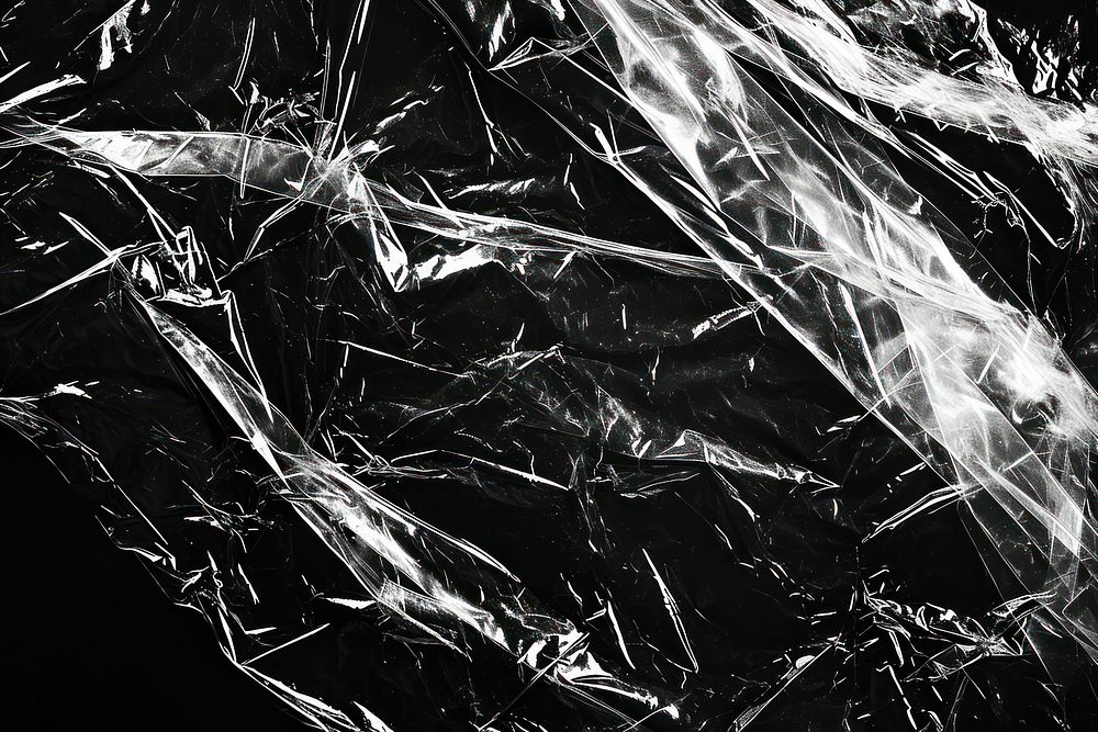 Transparent plastic wrap backgrounds black black background.