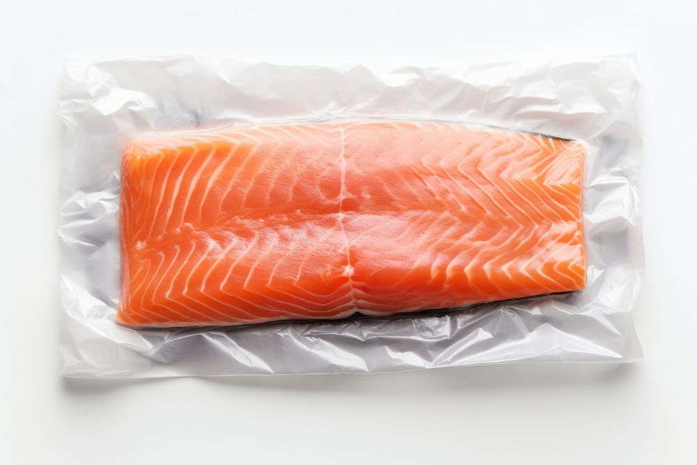 Plastic wrapping over a salmon seafood white background freshness.