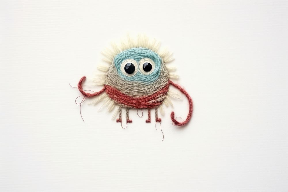 Embroidery of cute monster animal stitch art.