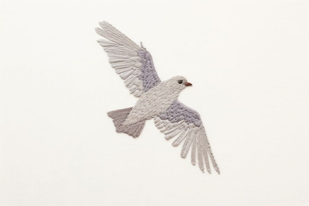 Embroidery of dove animal flying bird.
