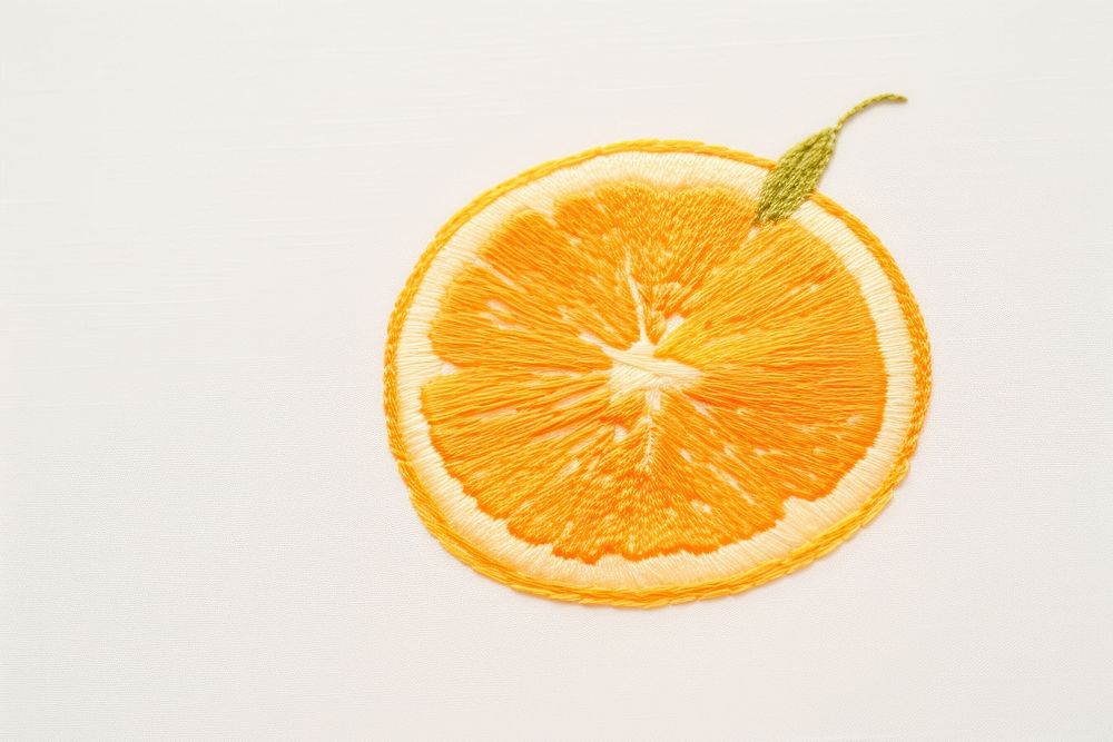 Embroidery of orange fruit grapefruit lemon plant.