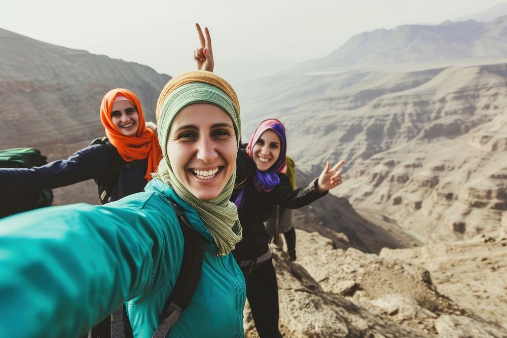 Young hiker Middle eastern women taking selfie portrait hiking adventure.