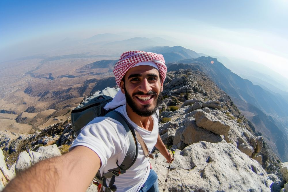 Young hiker Middle eastern man taking selfie mountain portrait hiking.