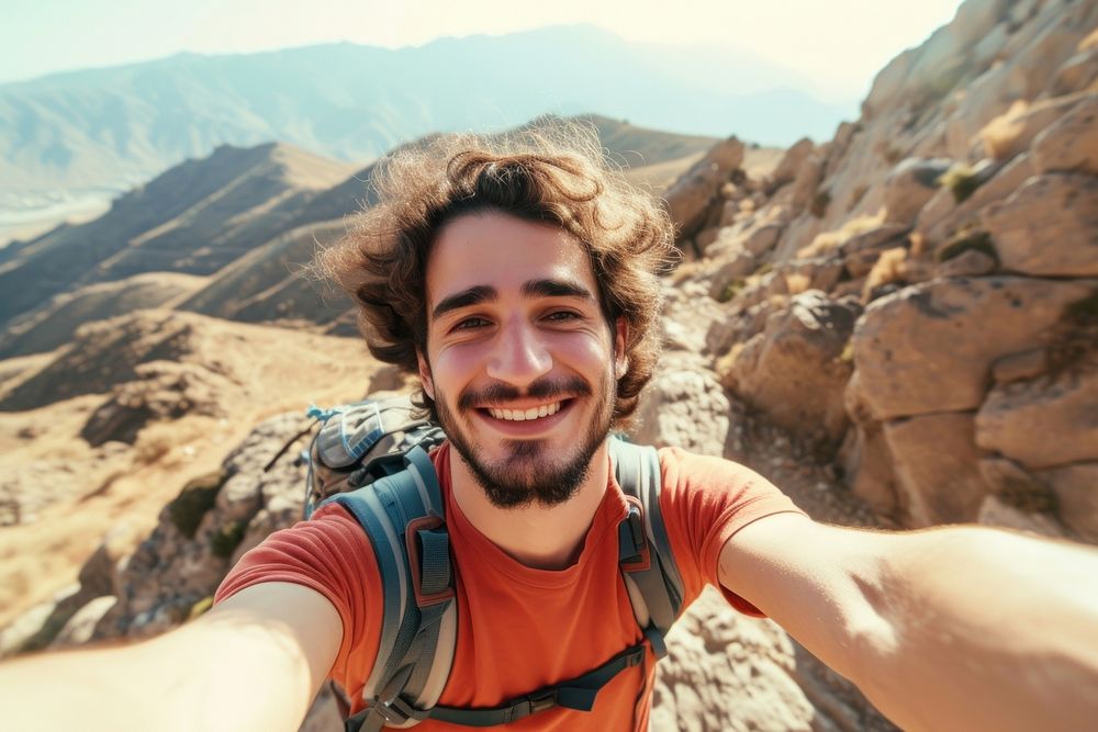 Young hiker Middle eastern man taking selfie portrait hiking recreation.