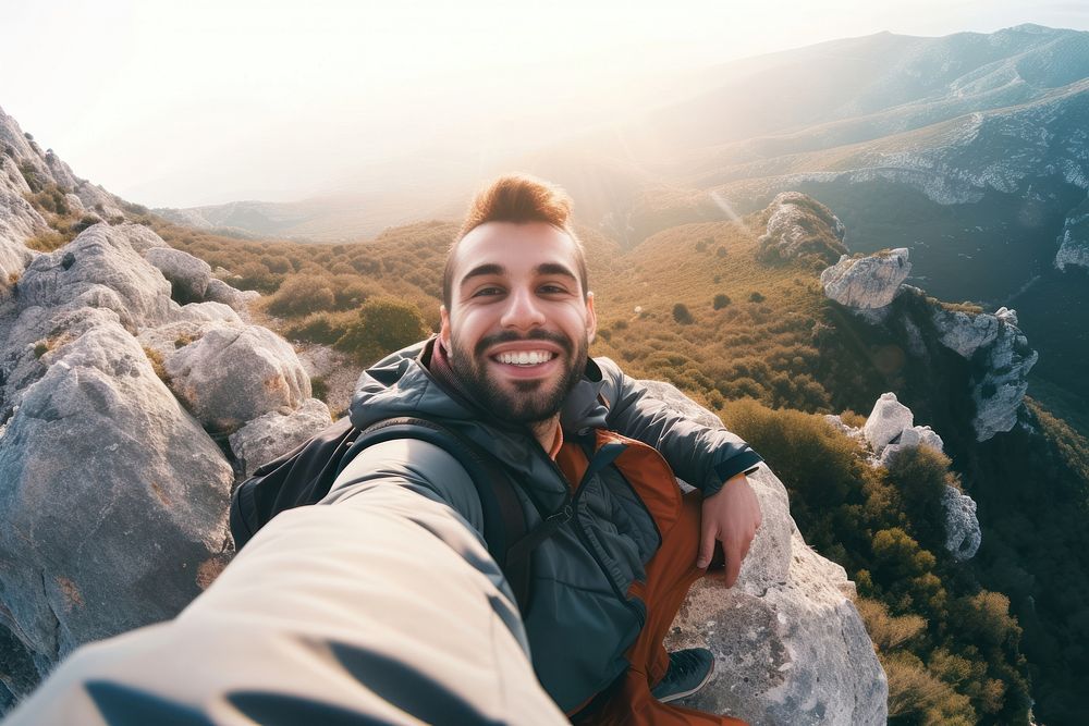 Young hiker Middle eastern man taking selfie mountain portrait hiking.