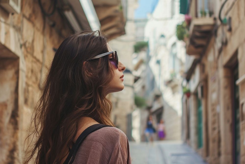 Young Israeli travel woman sunglasses portrait outdoors.