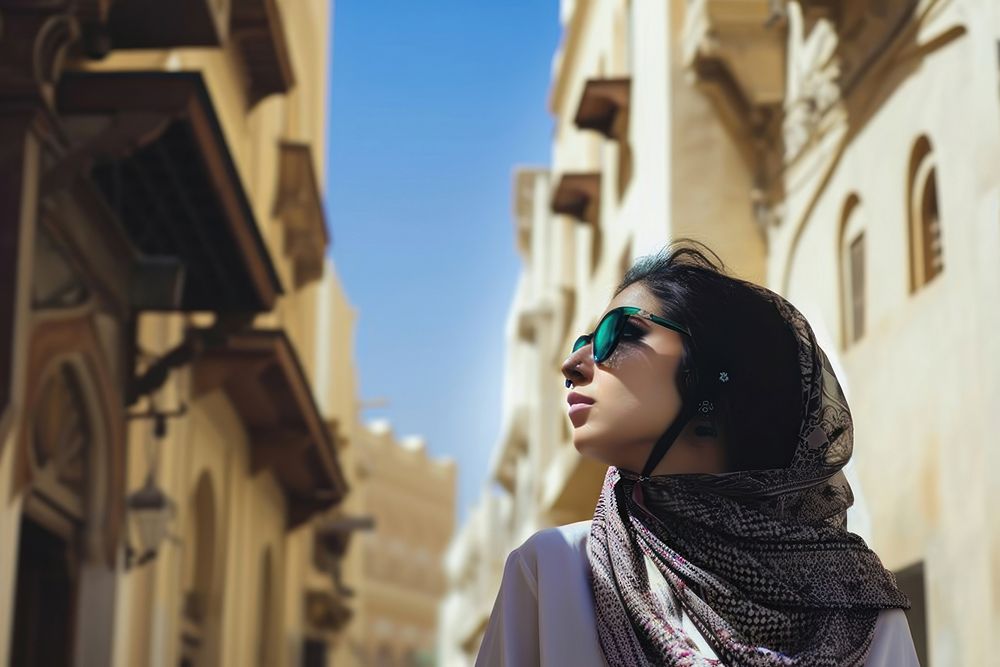 Young Saudi Arabian travel woman outdoors adult contemplation.