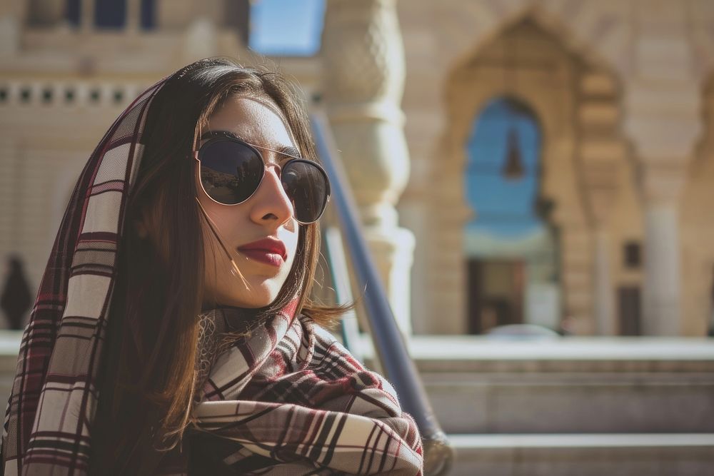Young Saudi Arabian travel woman sunglasses portrait outdoors.