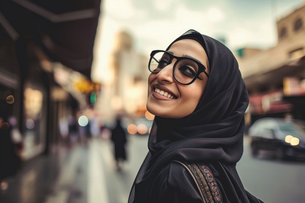 Young Saudi Arabian travel woman portrait outdoors glasses.