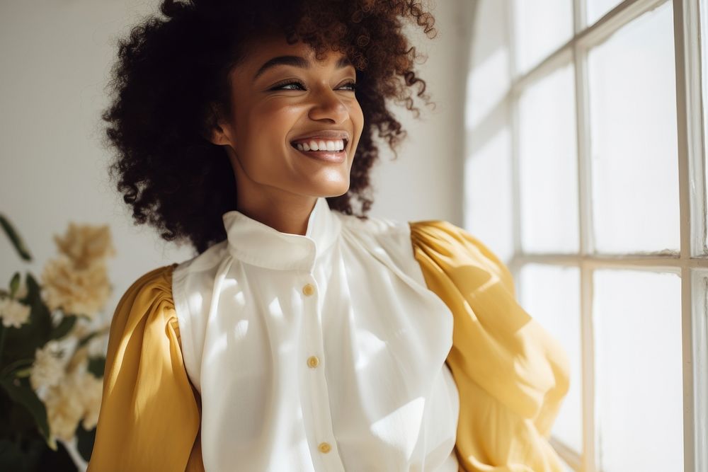 Black woman wearing Curator LEMON CHIFFON smile blouse adult.