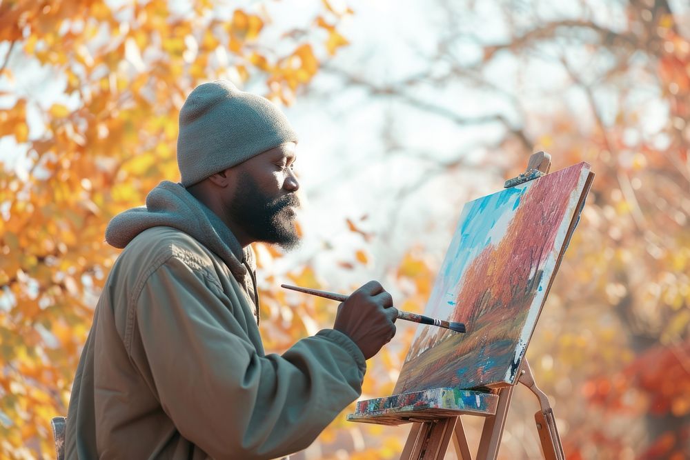 Black artist painting a scenic landscape creativity brush paintbrush.