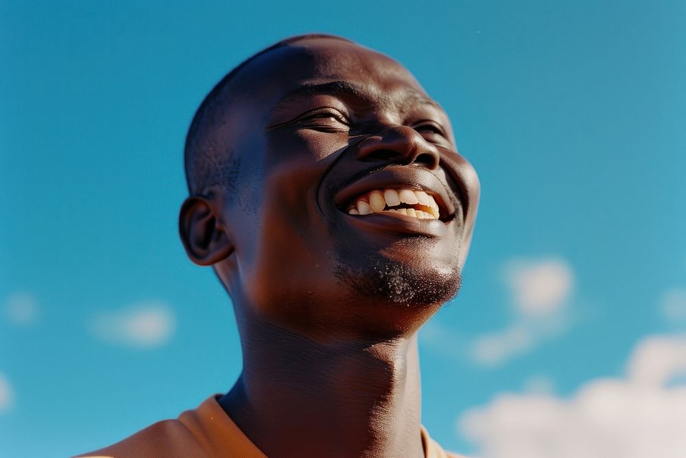 Smiling african man laughs outside laughing smile adult.