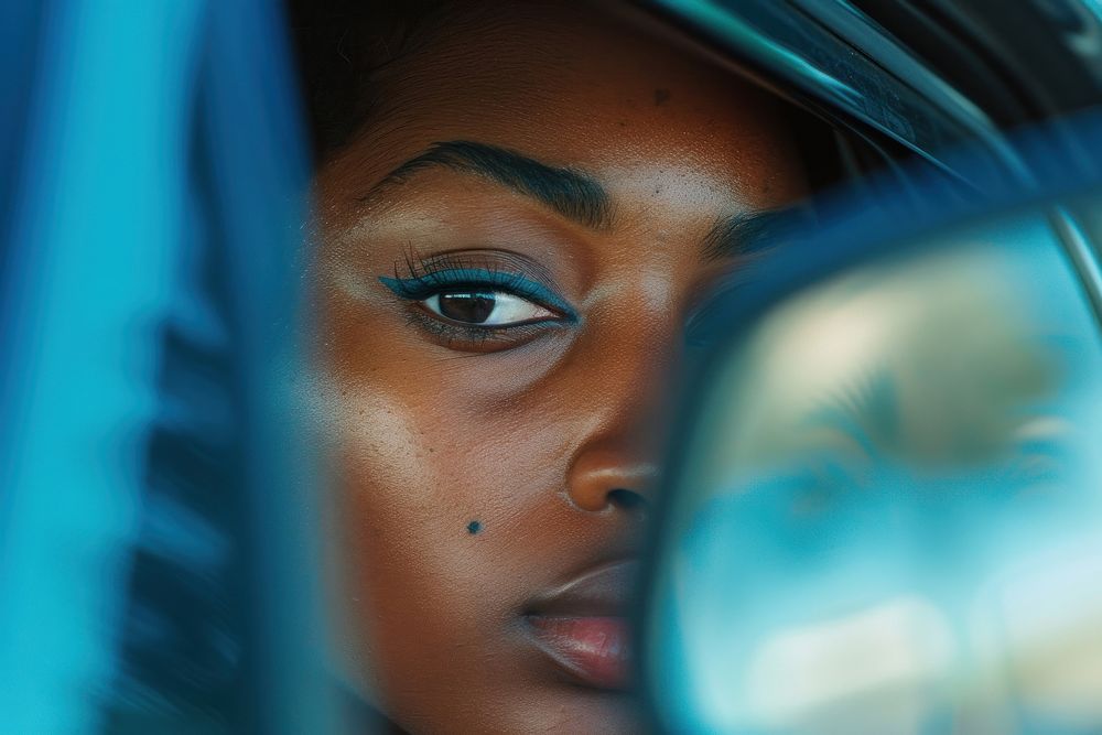 Black woman in Side view mirror photography reflection portrait.