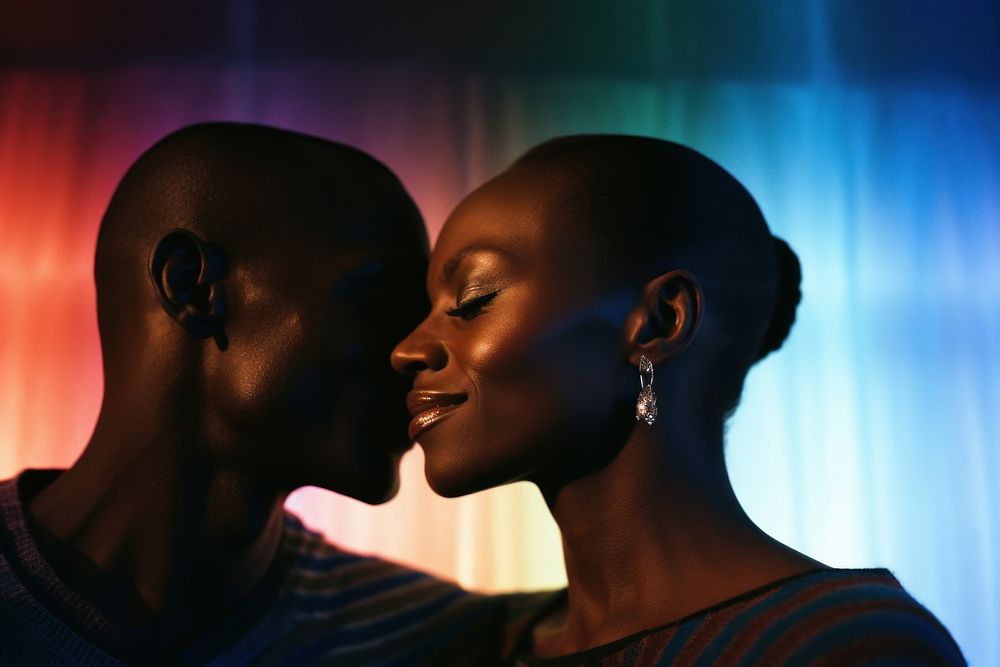 Rainbow light on black couple face photography portrait kissing.