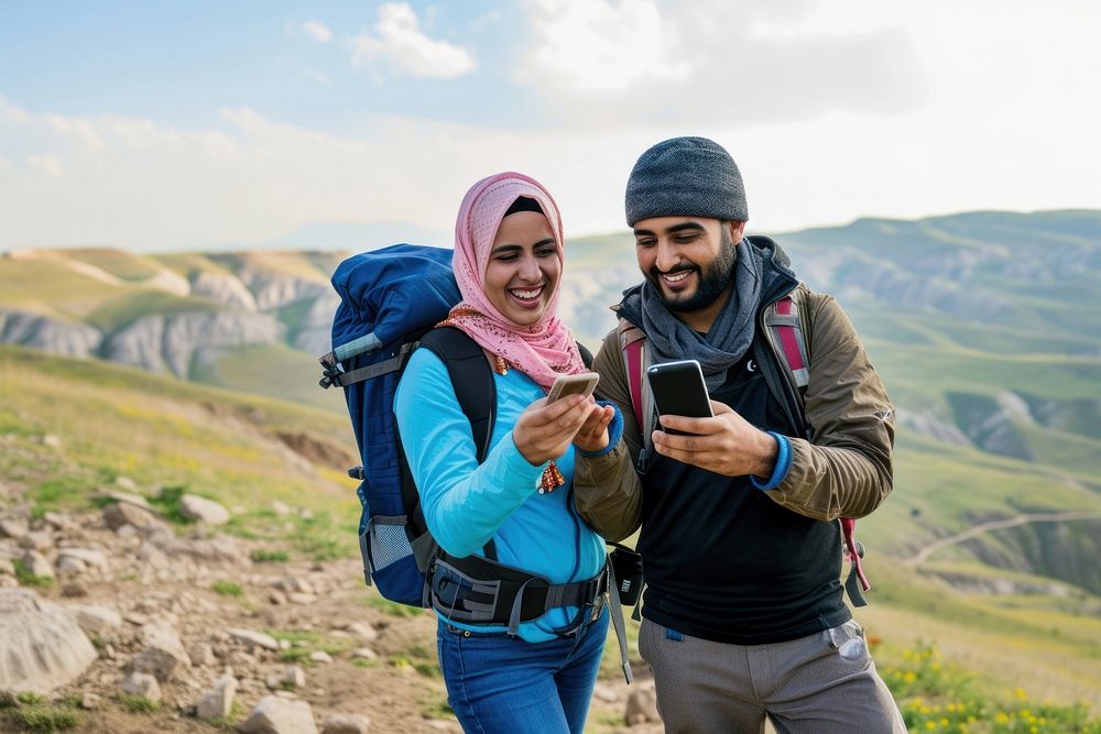 Middle eastern couple of hikers selfie adult phone.