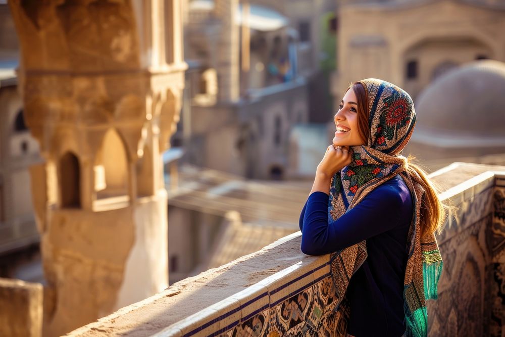 Happy Middle eastern girl traveler on the viewing architecture spirituality headscarf.