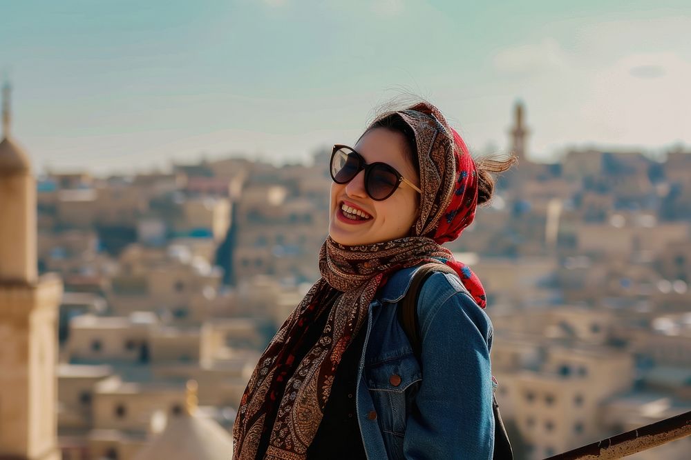 Happy Middle eastern girl traveler on the viewing portrait scarf architecture.