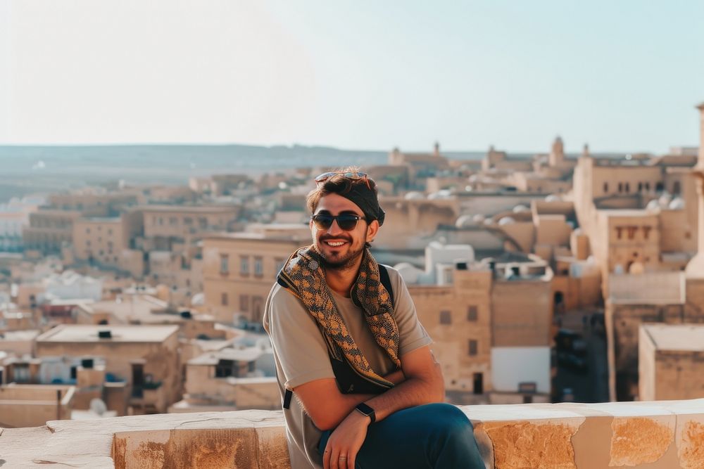 Happy Middle eastern man traveler architecture outdoors city.