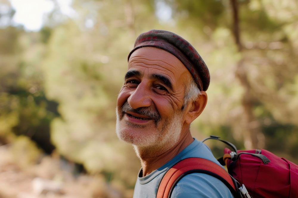 Senior Middle eastern man hiking outdoors portrait forest travel.