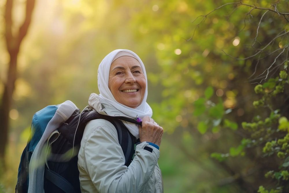 Senior Middle eastern woman hiking outdoors forest travel adult.