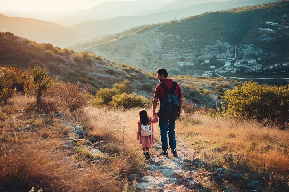 Middle eastern father and daughter travelling walking hiking adventure.