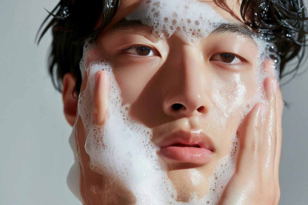Korean man washing face forehead.
