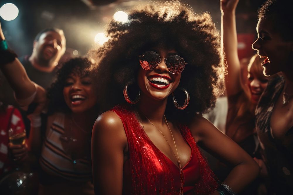 Black woman with friends laughing dancing glasses.