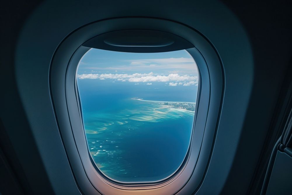 Window see paradise island airplane porthole vehicle.