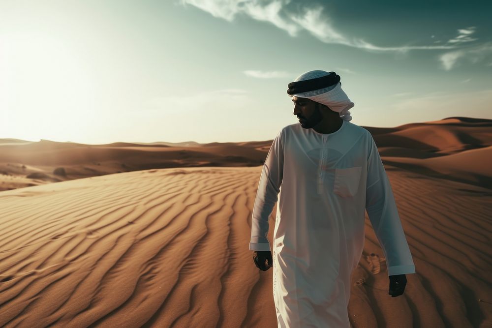 Middle Eastern Man standing outdoors walking.