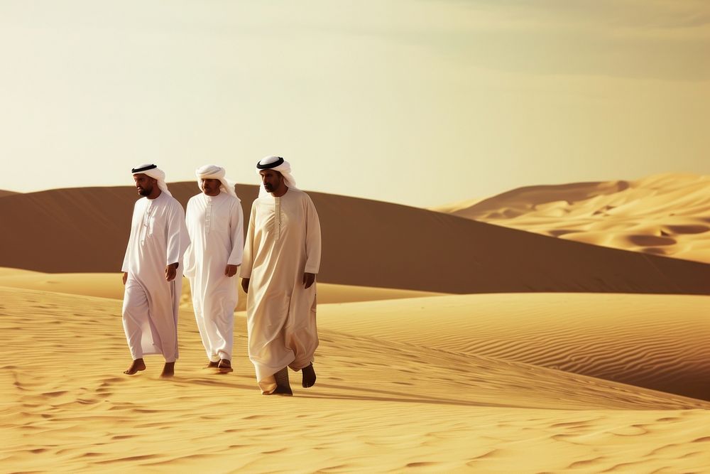 Middle Eastern Men walking desert standing.