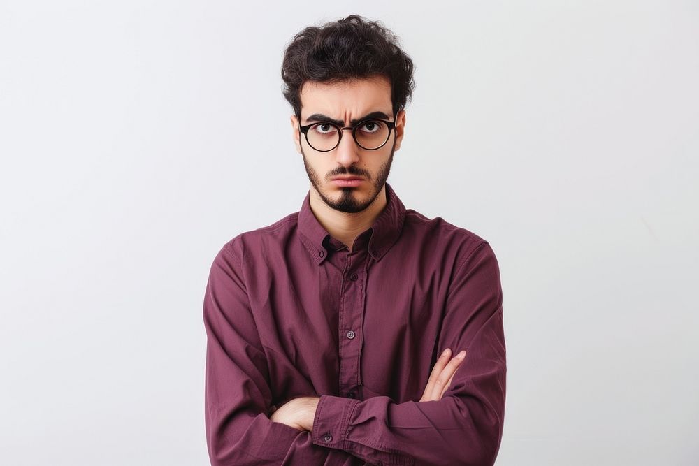 Young middle eastern man portrait glasses serious.