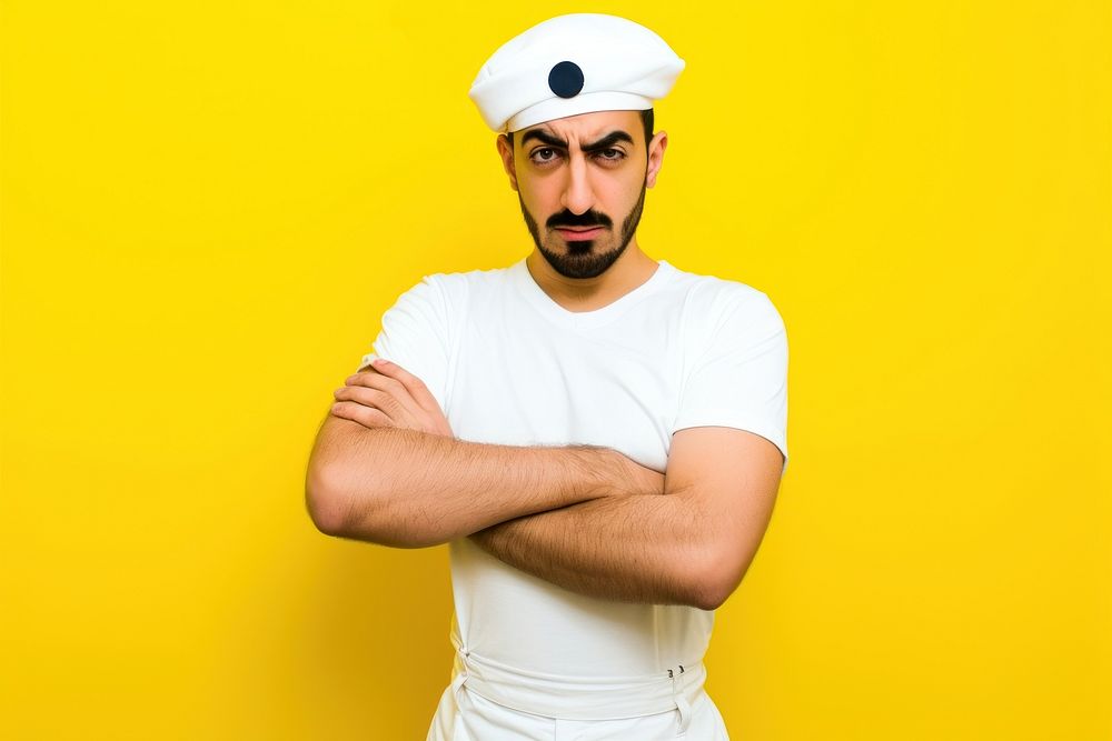 Young middle eastern man portrait serious yellow.