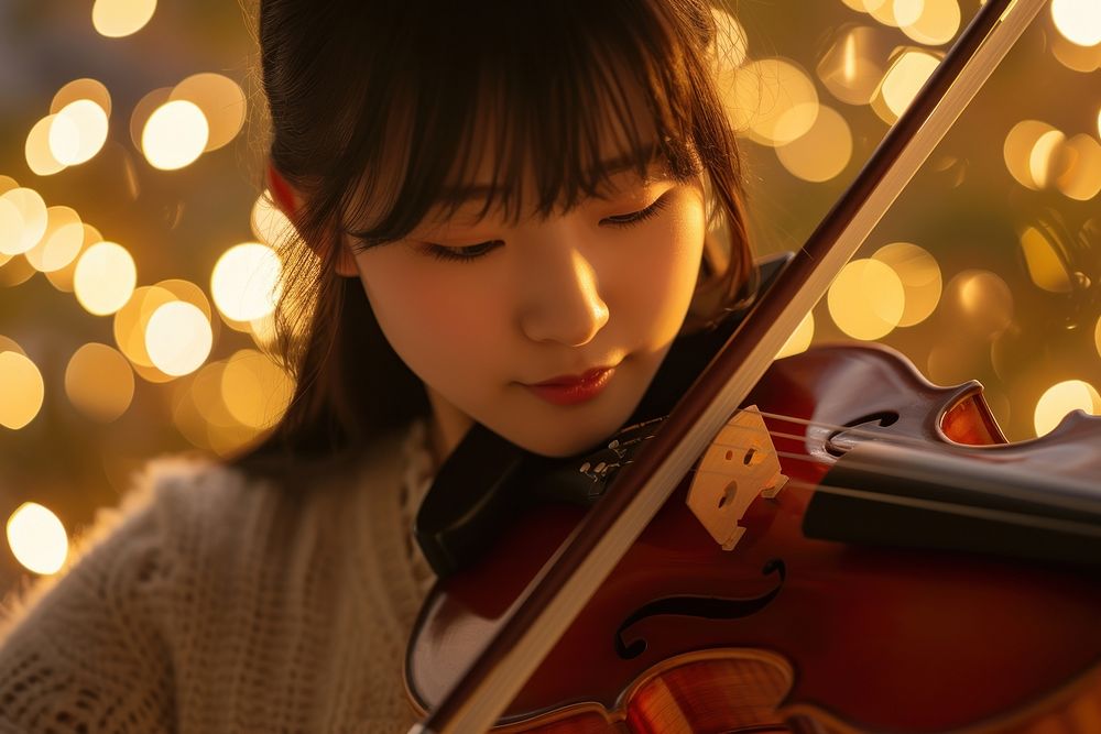 Japanese high school woman violin musician concentration.