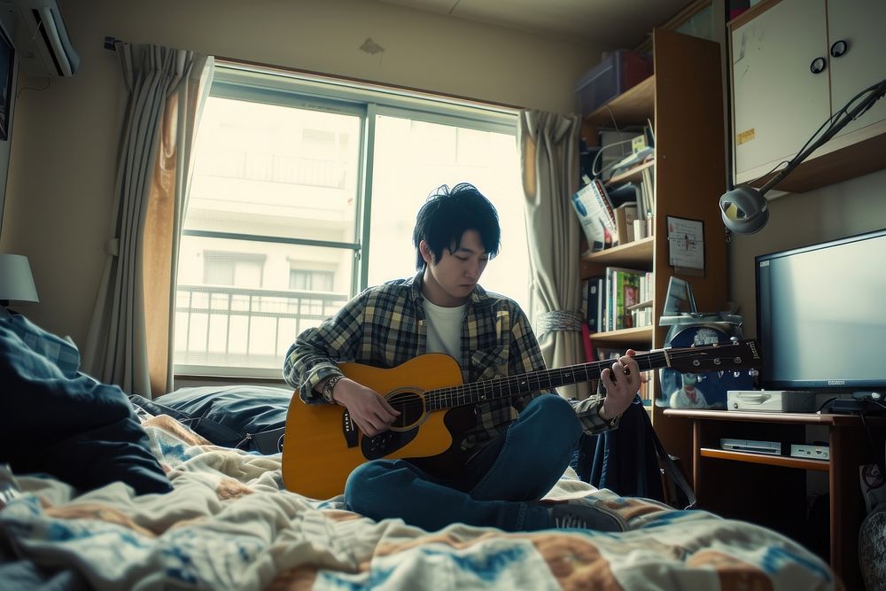 Japanese high school man guitar furniture musician.