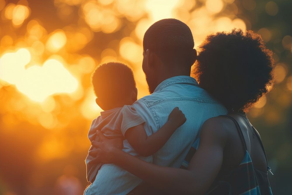 African American family silhouette father sunset.