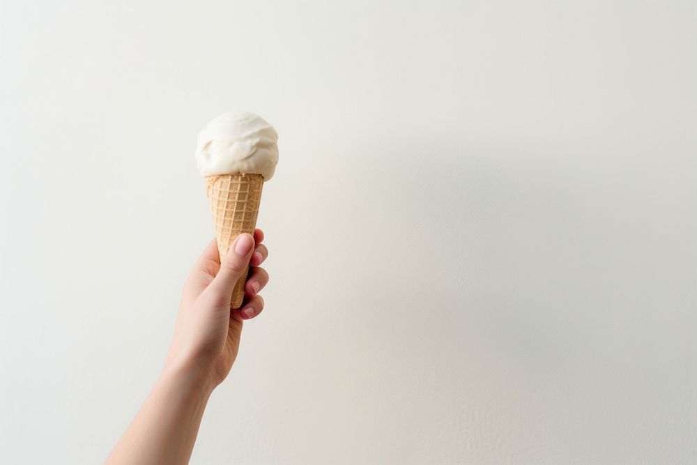 Hand holding icecream dessert white food. AI generated Image by rawpixel.