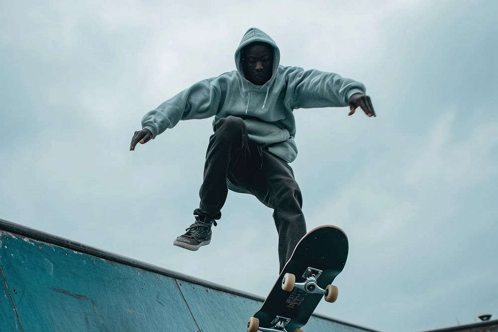Black male skateboard skateboarder jumping.
