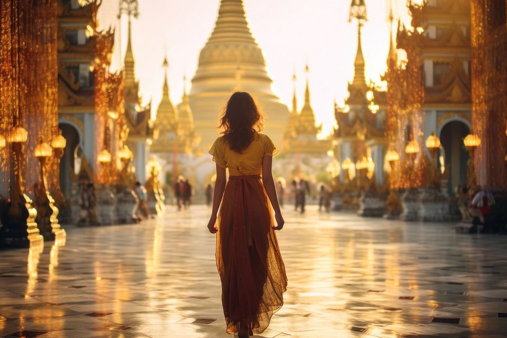  Thai woman visit the Sacred Shwedagon Pagoda in Myanmar outdoors pagoda adult. AI generated Image by rawpixel.