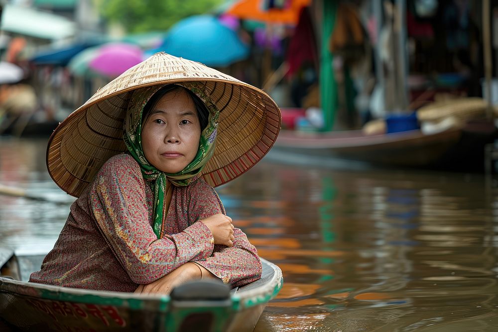 Korean female sitiing in the boat in Floating Market of Khlong Lat Mayom market adult architecture.