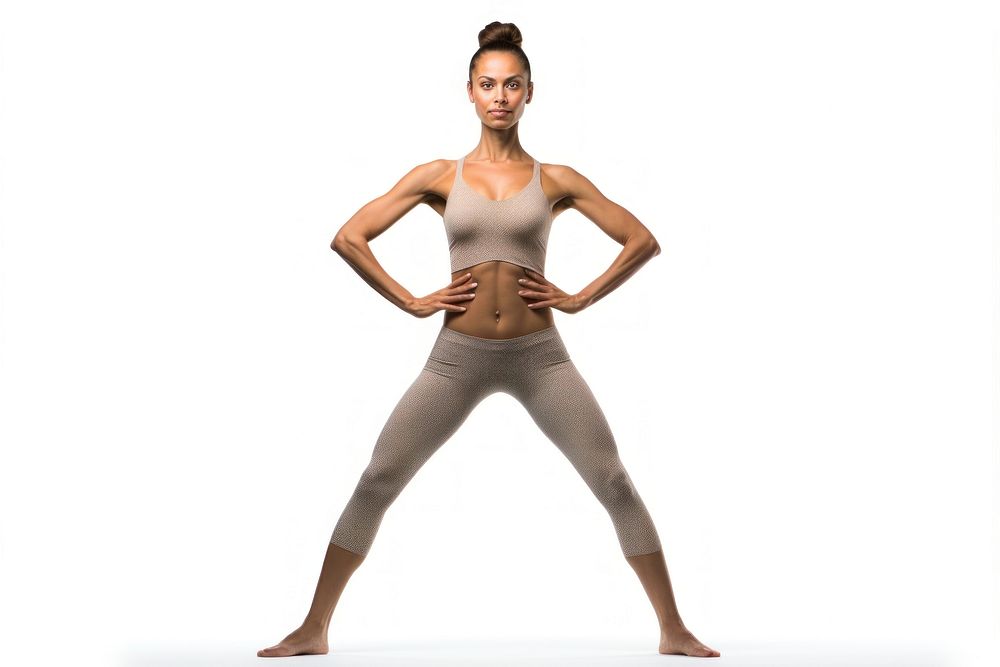 Full length portrait of a fit American woman standing in a yoga position sports adult determination.
