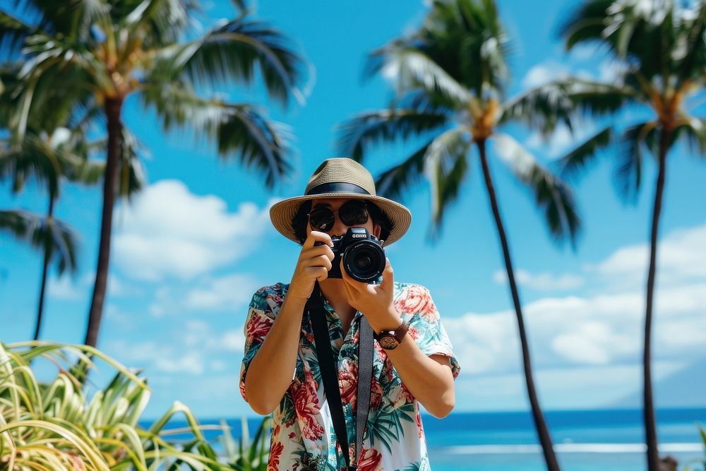 Japanese taking a picture in Hawaii background vacation adult photo.