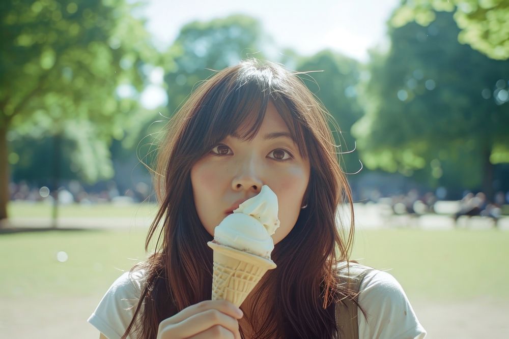 Japanese eating ice cream in Clapham Common contemplation photo shoot relaxation.
