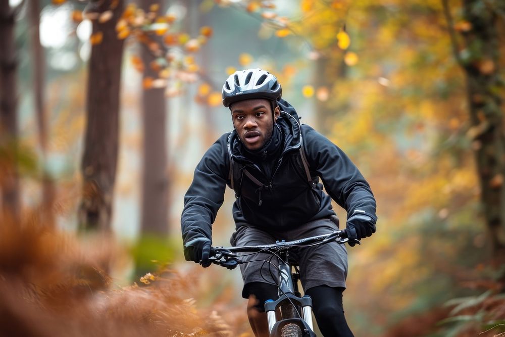 Balck young man bicycle sports vehicle.