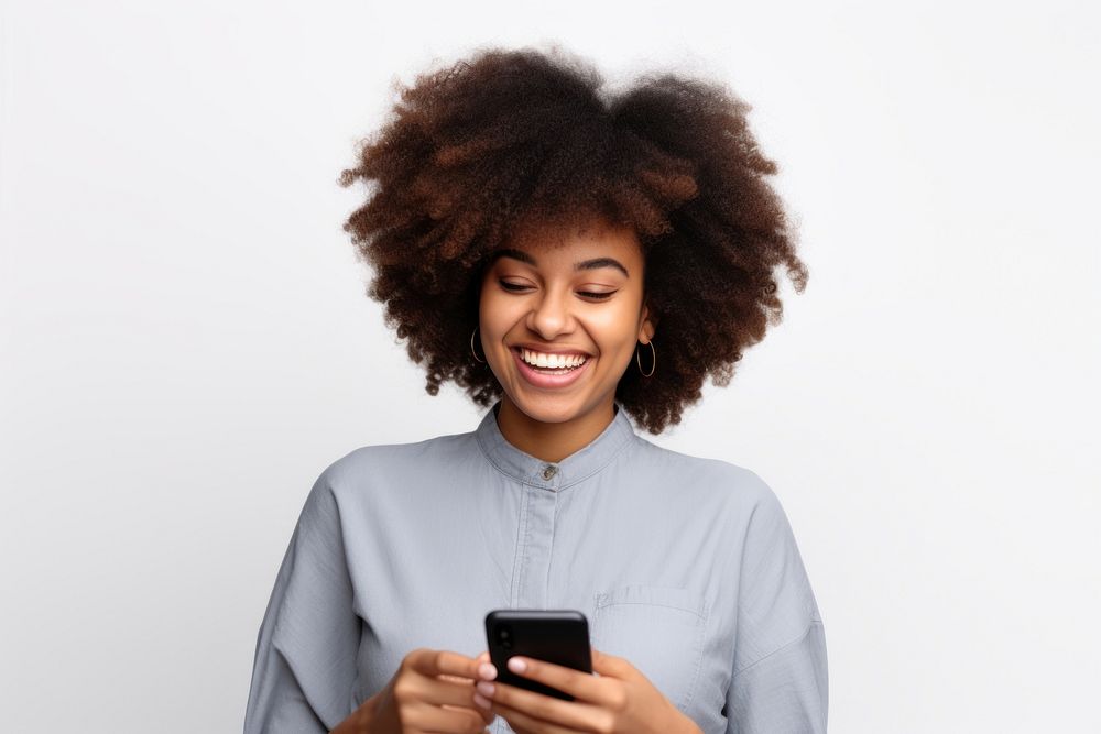 Cheerful black woman using phone smile adult white background.