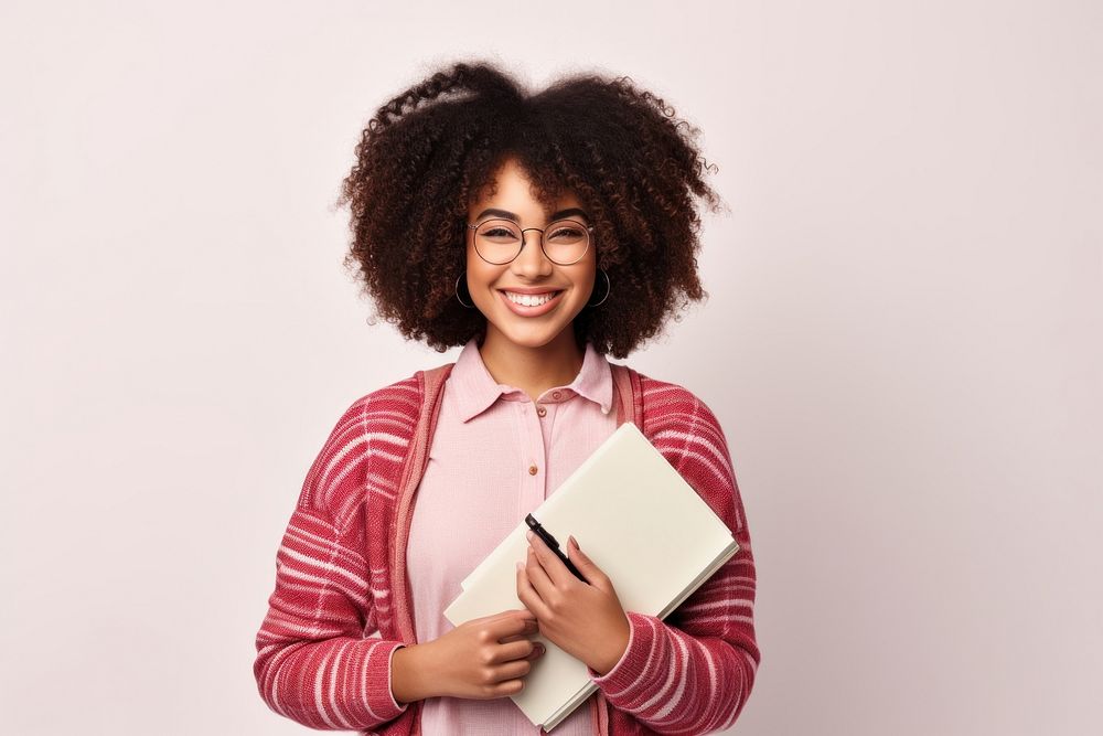 College student holding books glasses smile adult. AI generated Image by rawpixel.